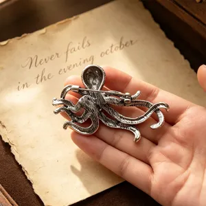 Vintage silver octopus brooch pin, retro marine animal lapel accessory for coat suit.