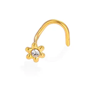 Gold stainless steel flower nose stud with clear cubic zirconia detail close-up shot.