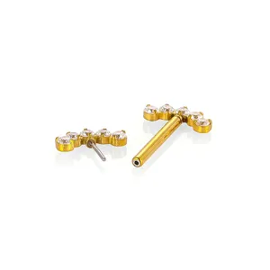 Stainless steel crystal curved body piercing jewelry detail view, elegant gold finish.