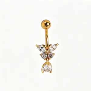 Detailed close-up of the gold-toned butterfly navel ring featuring sparkling cubic zirconia stones.