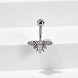 Detailed macro view of cubic zirconia bee navel ring body piercing jewelry display