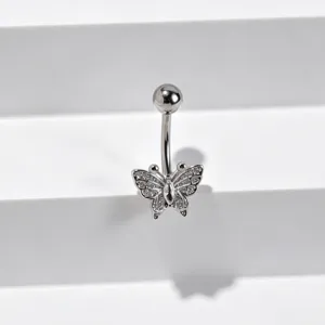 Detailed close-up of a stainless steel navel piercing featuring a sparkling zircon butterfly.