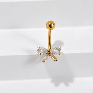 Gold-toned navel piercing ring featuring a sparkling cubic zirconia bow charm detail for women.