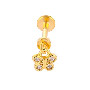 Goldfarbenes Edelstahl Schmetterling Labret Piercing Schmuck mit Zirkonia Steinen.