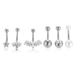Set of 6 stainless steel navel rings with cubic zirconia and pearls for body piercing.