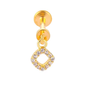 Close-up detail of gold titanium steel body piercing jewelry with a square cubic zirconia charm.