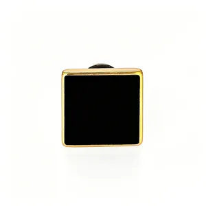 Minimalist square stud earring with a sleek gold-toned frame and solid black center design.