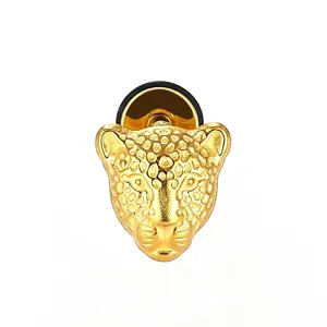 Gold leopard head ear stud detail close-up, punk retro piercing stainless steel jewelry.