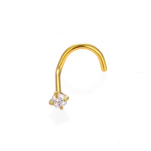 Gold steel nose stud with clear cubic zirconia crystal, L-shaped piercing detail.