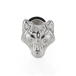 Stainless steel wolf head ear plug detail view, showing intricate carved tribal metal texture.