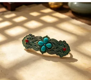 Fermaglio per capelli vintage con fiore turchese a quattro foglie in stile palazzo.