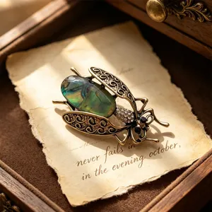 Vintage abalone shell insect brooch, exquisite moth pin for women, elegant coat accessory.