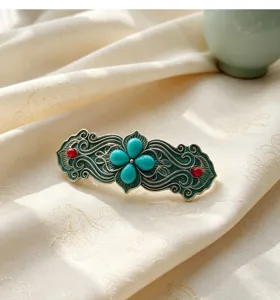 Raffinato fermaglio per capelli vintage con pietre turchesi, design smaltato in filigrana.