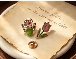 Close-up detail shot of vintage enamel flower basket and purple tulip lapel pins on retro paper.