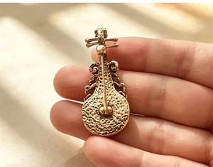 Detailed view of the vintage Chinese style Pipa brooch back pin mechanism, elegant craftsmanship.