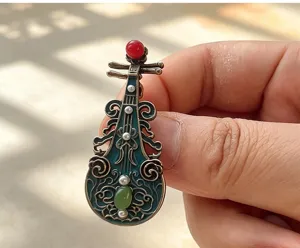 Exquisite Dunhuang Tang style Pipa brooch with blue enamel, red bead and green jade detail.