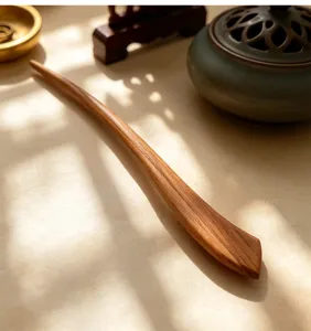Close-up detail of a wooden hair stick, new Chinese style hairpin with elegant wood texture.