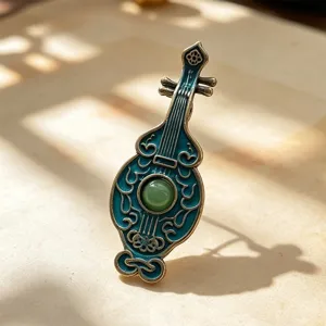 Dunhuang style Pipa brooch with blue enamel finish and green bead. Elegant Chinese pin.