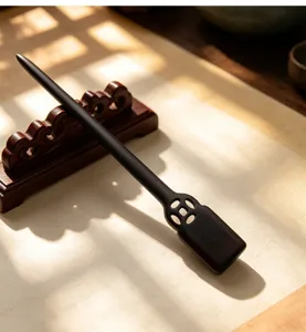Detailed view of traditional Chinese wooden hairpin on display stand, retro design for hanfu.