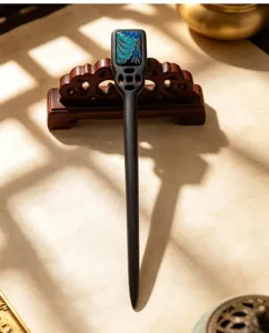 Detail of traditional Chinese style wooden hair stick with blue brocade inlay, elegant hairpin.