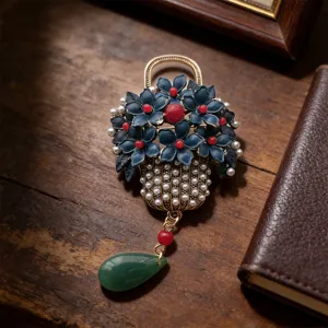 Vintage imitation blue enamel flower basket brooch with pearls red beads and green tassel.
