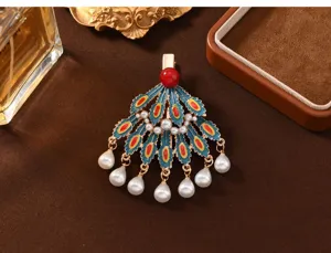 Chinese style peacock feather hairpin detail with enamel, faux pearls and pearl tassels.