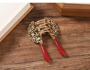 Chinese style hair claw clip with elegant red tassel, vintage metal butterfly hairpin detail.