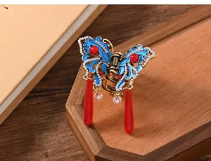 Retro Chinese style blue enamel butterfly hair claw clip with pearls and red tassels for women.