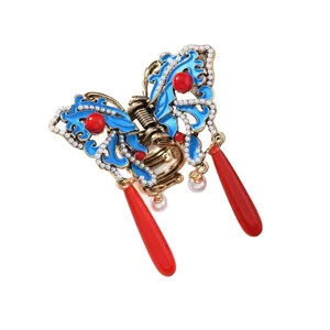 Chinese style vintage butterfly hair claw clip with tassels, elegant blue enamel design.