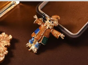 Vintage enamel scarecrow brooch pin, retro gold-plated clown coat jewelry for women and men.