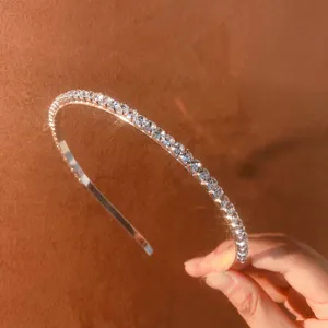 Detailed close-up of a sparkling rhinestone thin headband, elegant hair accessory for daily wear.