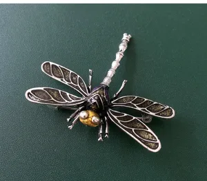 Exquisite vintage dragonfly brooch pin with enamel details, elegant insect sweater accessory.