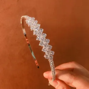 Exquisite sparkling rhinestone zircon crystal headband detail shot, elegant hair accessory.