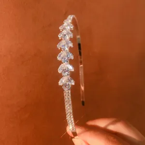 Detailed shot of sparkling rhinestone zircon headband, elegant silver hair accessory for daily wear.