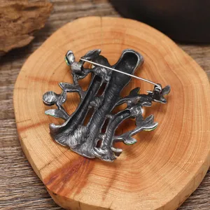 Detailed close-up showing the secure pin mechanism and textured back of the vintage brooch.