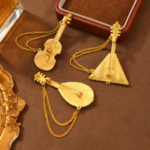 Conjunto de broches musicales vintage con elegantes borlas colgantes para abrigos.