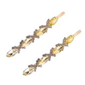 Vue détaillée de longue épingle à cheveux strass avec cristaux marquise jaunes et base métal.