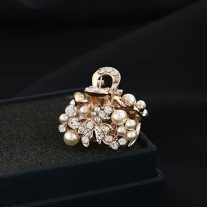 Mini pearl rhinestone hair claw clip detail, elegant floral hair accessory for women.
