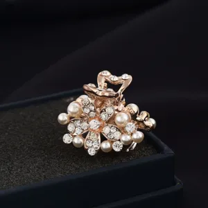 Pearl and rhinestone flower mini hair claw clip detail, elegant fashion hair accessory.