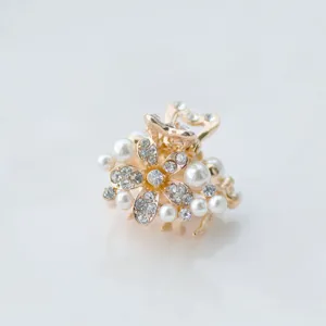 Pearl flower mini hair claw clip for women, cute hair accessories for styling bangs.