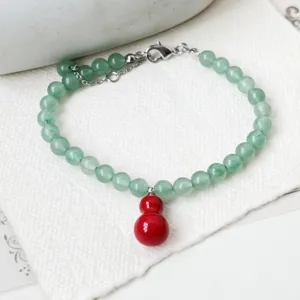 Exquisite green aventurine bead necklace featuring a vibrant red gourd pendant for elegant style.
