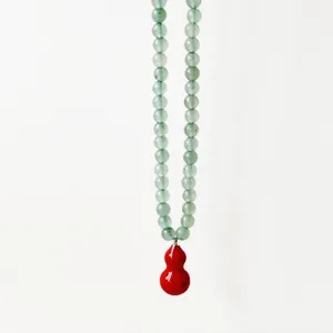 Elegant green jadeite beaded necklace featuring a glossy red gourd pendant for women daily wear.