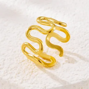 Gold plated wavy ring detail shot showing the unique curved design and shiny metallic texture.
