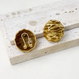Vintage textured gold clip earrings for women, chic metal statement ear accessories.