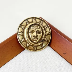 Vintage sun and moon face relief metal brooch creative badge pin for coats bags and suits.