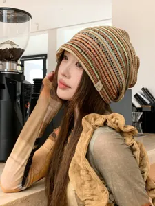 Detailed view of retro multi-color striped knit slouchy beanie, breathable texture for summer.