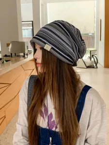 Detailed view of the retro striped knitted slouchy beanie hat, showing texture and fit.