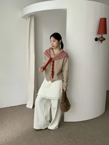Korean style winter wool cardigan set with striped scarf for women. Cozy and stylish daily wear.