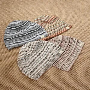 Retro striped knit beanie detail, showing multi-color patterns and soft fabric for daily wear.