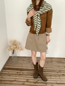 Korean striped knit triangular shawl paired with suede jacket for stylish autumn wear detail.